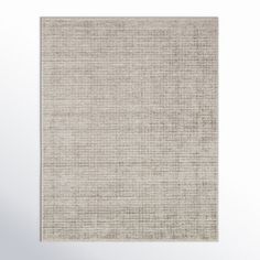 a beige rug on a white wall