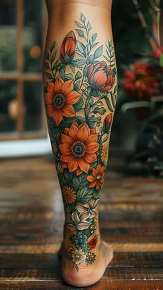 a woman's leg with flowers on it