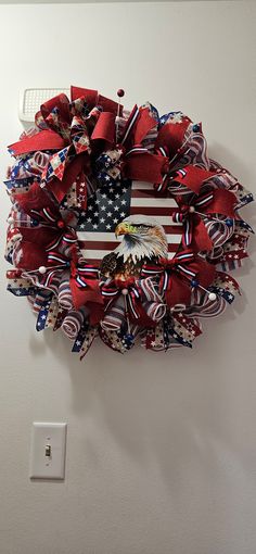 an american flag wreath hanging on the wall