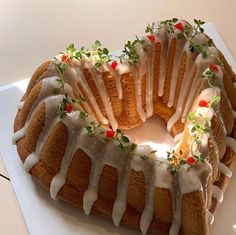 a bundt cake with icing and sprigs on top