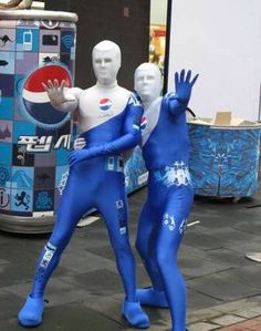 two mannequins dressed in blue and white standing next to each other