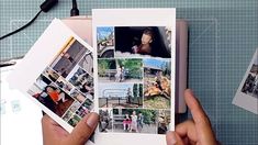 a person holding up some photos on top of a table