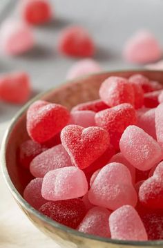 a bowl filled with pink and red sugar hearts