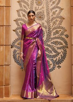 Our custom-made sarees are designed for effortless elegance, tailored specifically for each client. Each saree includes an unstitched blouse piece for personalisation. Featuring pre-pleated pleats and a simple skirt-like draping style, our sarees ensure comfort even during extended wear. The saree is crafted from blended silk and measures 5.5 meters in length, providing ample fabric for various draping styles. Additionally, the unstitched blouse piece, measuring 0.8 meters, can be customised at an additional cost to perfectly complement your saree. The pallu is left unstitched, allowing for versatile styling options--whether you prefer an open pallu or neatly pleated look. Fabric: Blended Silk  Saree Length: 5.5 meters  Blouse Piece: 0.8 meter  Time to Ship: 7 to 8 working days Purple Weave, Lace Saree, Purple Saree, Wedding Saree Indian, Party Kleidung, Art Silk Sarees, Kanjivaram Sarees, Silk Sarees Online, Purple Silk