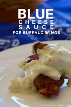 blue cheese sauce for buffalo wings on a white plate with text overlay that reads, blue cheese sauce for buffalo wings