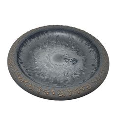 a decorative bowl is shown on a white background