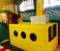 there is a yellow submarine made out of cardboard