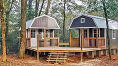 two tiny houses in the woods surrounded by trees