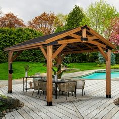 a wooden gazebo sitting on top of a wooden deck next to a swimming pool