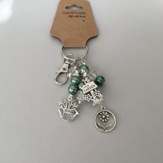 a keychain with charms attached to it