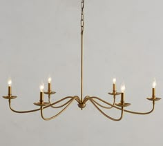 a chandelier with five candles hanging from it's arms and four lights on each end