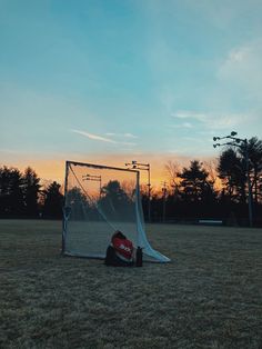 a soccer goal sitting on top of a field