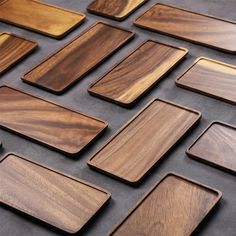 many different types of wood are arranged on the table top, including square and rectangle shapes