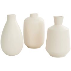 three white vases sitting next to each other