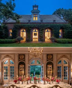 the dining room and living room in this house are both decorated with chandeliers