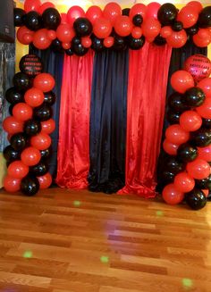 black and red balloon arch for an event