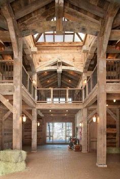 the inside of a large wooden building with stairs