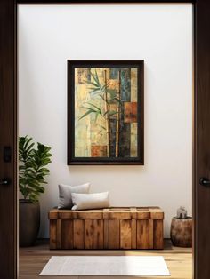 a painting hanging on the wall above a wooden bench in a room with white walls