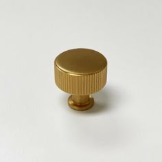 an image of a gold knob on a white background