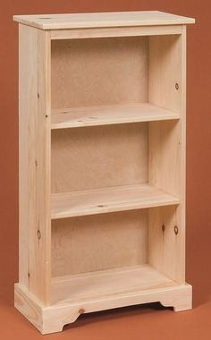 a wooden bookcase with three shelves on each side and one shelf above the other