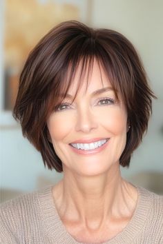 Piecey Brunette Layers with Wispy Bangs Hairstyle on a smiling older woman with brown hair. Piecey Bangs Medium Hair, Bob Hairstyles With Fringe, Facial Diy, Short Hairstyles For Older Women, Bobbed Hairstyles With Fringe, Mom Haircuts, Best Short Hairstyles, Hairstyles For Older Women, Shaggy Short Hair