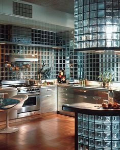 a kitchen filled with lots of counter top space next to a stove top oven and microwave