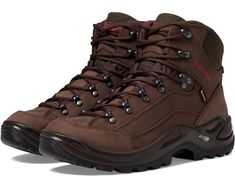 a pair of brown hiking boots on a white background