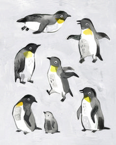 a group of penguins standing next to each other on top of a white surface with yellow and gray accents