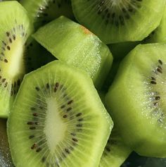 the kiwi is cut in half and ready to be sliced into bite sized pieces