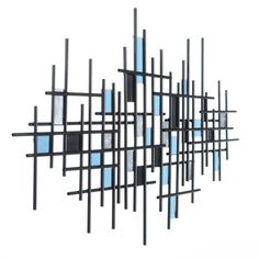 an abstract sculpture with blue and black squares on it's sides, against a white background