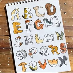 a notebook with the letters drawn on it