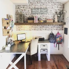 a room with a desk, chair and bookshelf on the wall above it