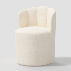 a white chair sitting on top of a floor