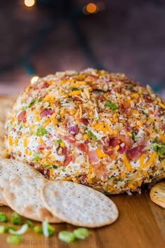 a cheese ball with crackers on the side