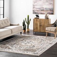 a living room filled with furniture and a rug