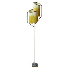 a floor lamp with two lamps on it