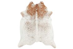 two white and brown cowhide rugs on a white background