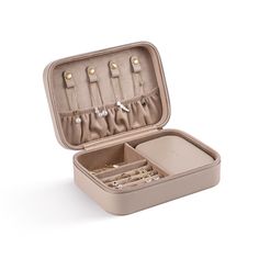 an open suitcase with jewelry inside on a white background