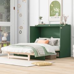 a bedroom with white walls and green furniture in the corner, along with an open window