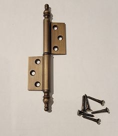 an image of a door hinge and screws