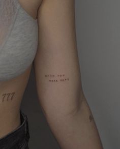 a woman's arm with writing on it