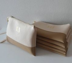 a white and tan purse sitting on top of a table