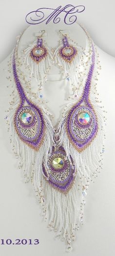 a white mannequin with purple beads and feathers