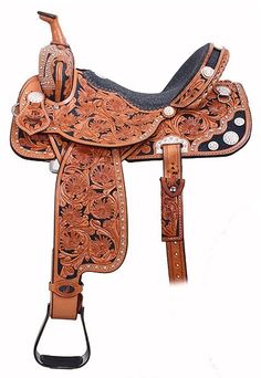 a brown and black horse saddle with an intricate design on the front, side and sides