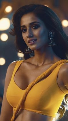 an image of a woman in a yellow dress with big cleavage and large earrings on her head