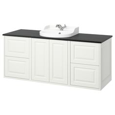 a white bathroom vanity with black counter top