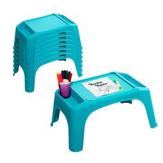 two blue plastic stools with writing on the top and one has colored pencils in it