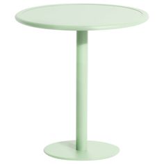 a round table with a light green base