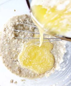 a bowl filled with oatmeal next to a whisk