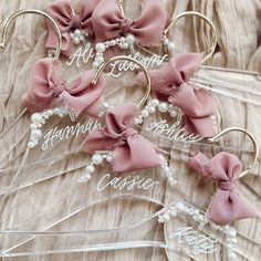 four hair clips with bows and pearls on them